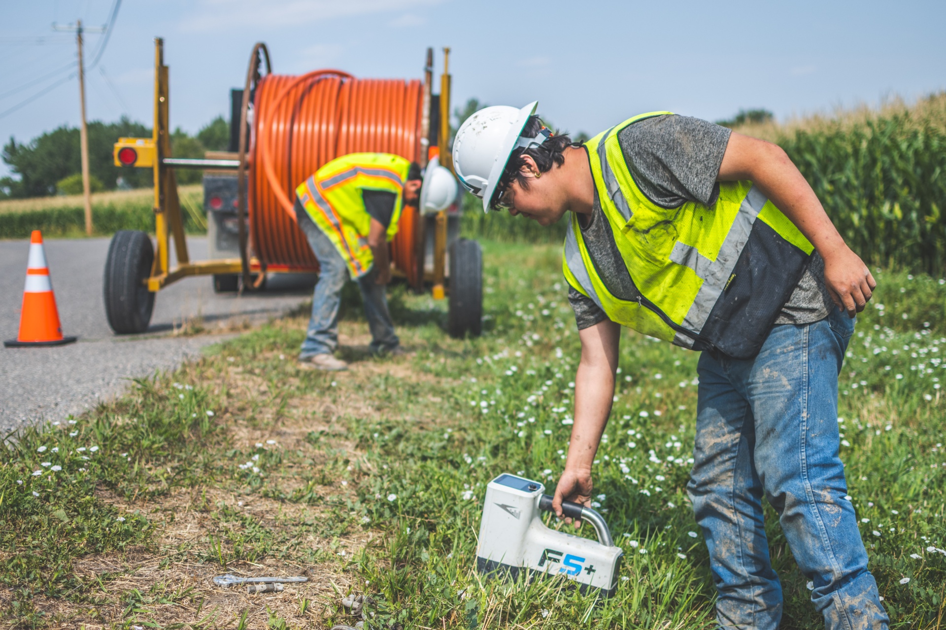 Technician installing last-mile fiber optic cable – Valhalla Industries